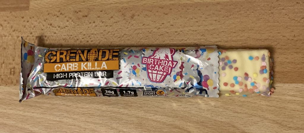 Birthday Cake. Best Grenade Carb Killa Flavour - We Reviewed 12 Carb Killa Flavours. We bought the Grenade Carb Killa Selection Box to review every flavour and find out which of the 12 bars is the tastiest! By Gymnasium Post (gymnasiumpost.com).